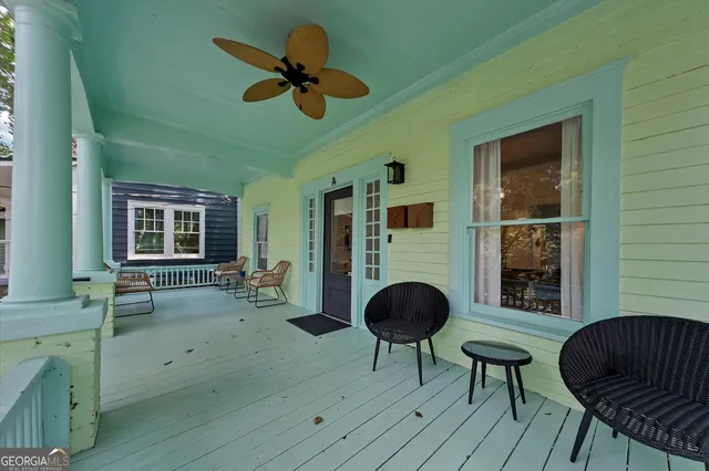 a view of a livingroom with furniture and a window