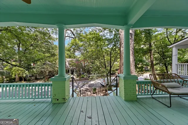 a view of a chairs and table in the deck