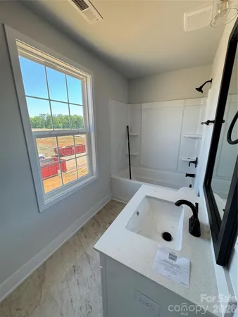 a bathroom with a sink and a vanity