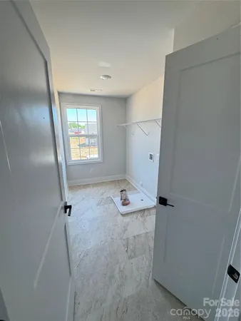 a bathroom with a tub sink and a mirror
