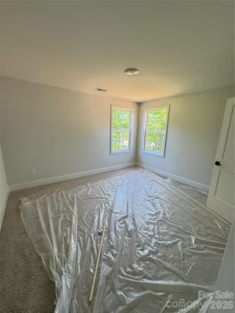 a view of room with window and hardwood floor