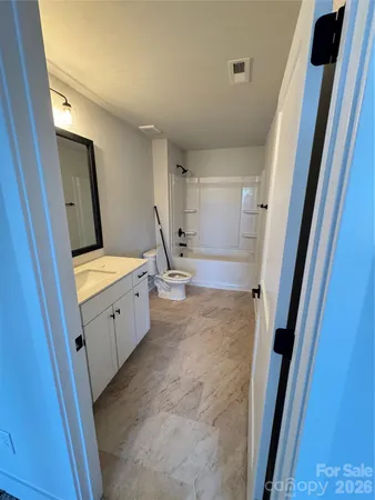 a view of a hallway with front door
