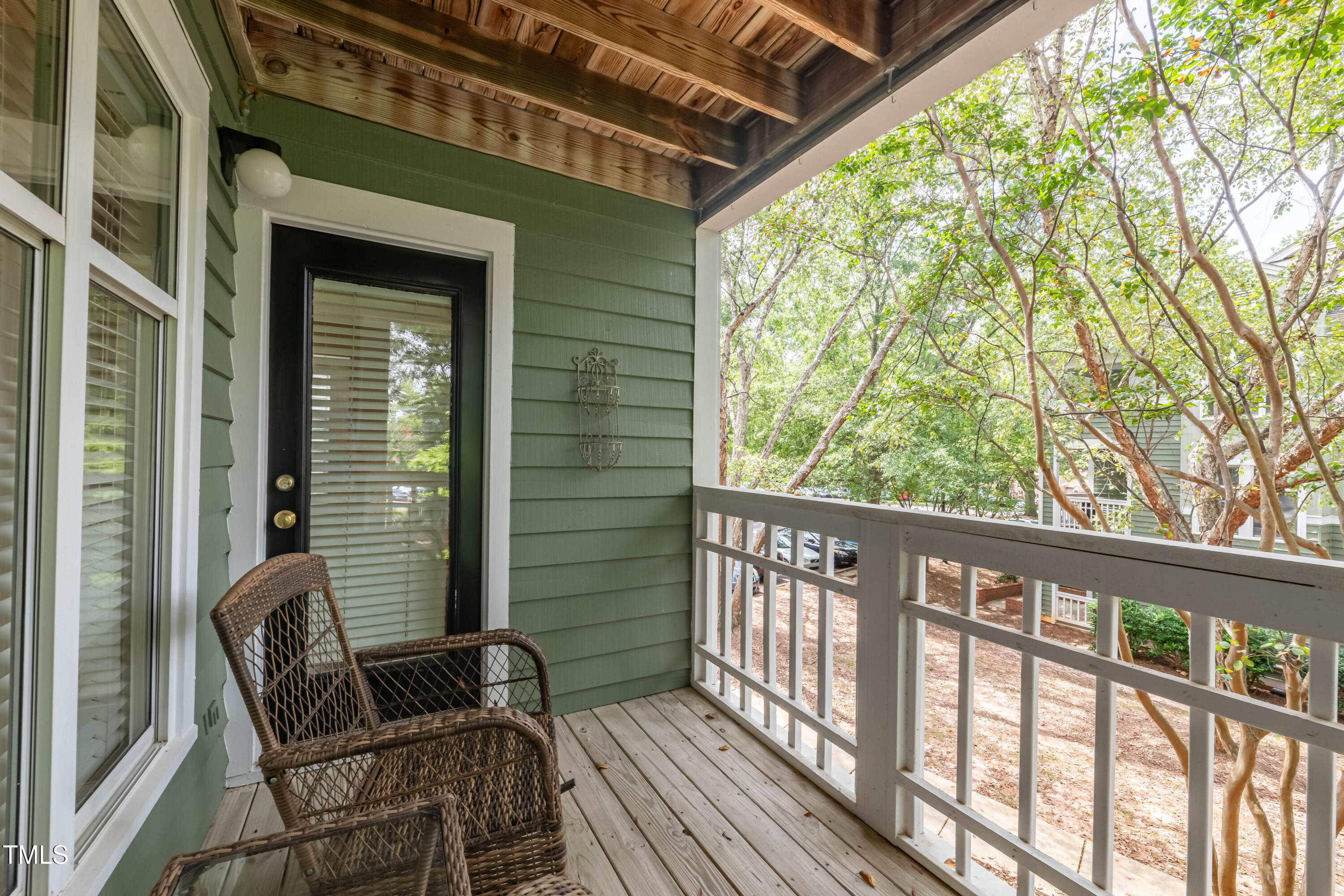 1211 Westview Lane, Unit 201 Raleigh, NC 27605 - Photo 22 of 40 a view of balcony with wooden floor and outdoor seating