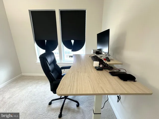 a view of workspace with lounge chair