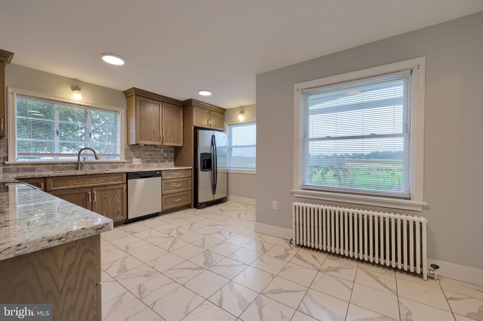 145 Weaver Road Lancaster, PA 17603 - Photo 23 of 87 a kitchen with stainless steel appliances a sink window and cabinets