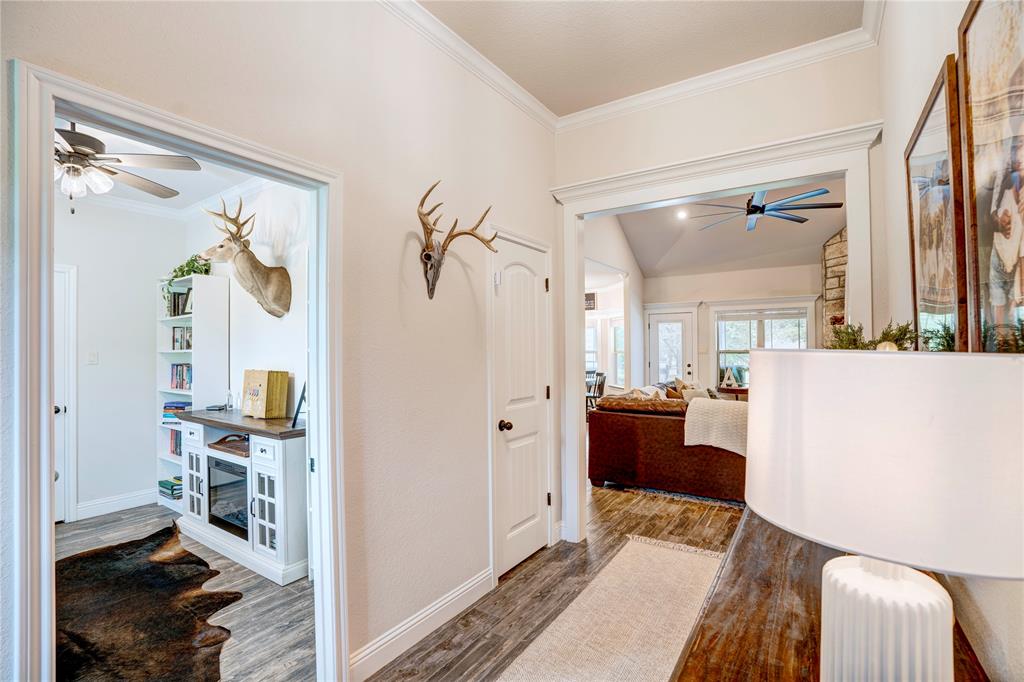 1355 Jay Bird Road Springtown, TX 76082 - Photo 4 of 40 a bedroom with furniture and a wooden floor