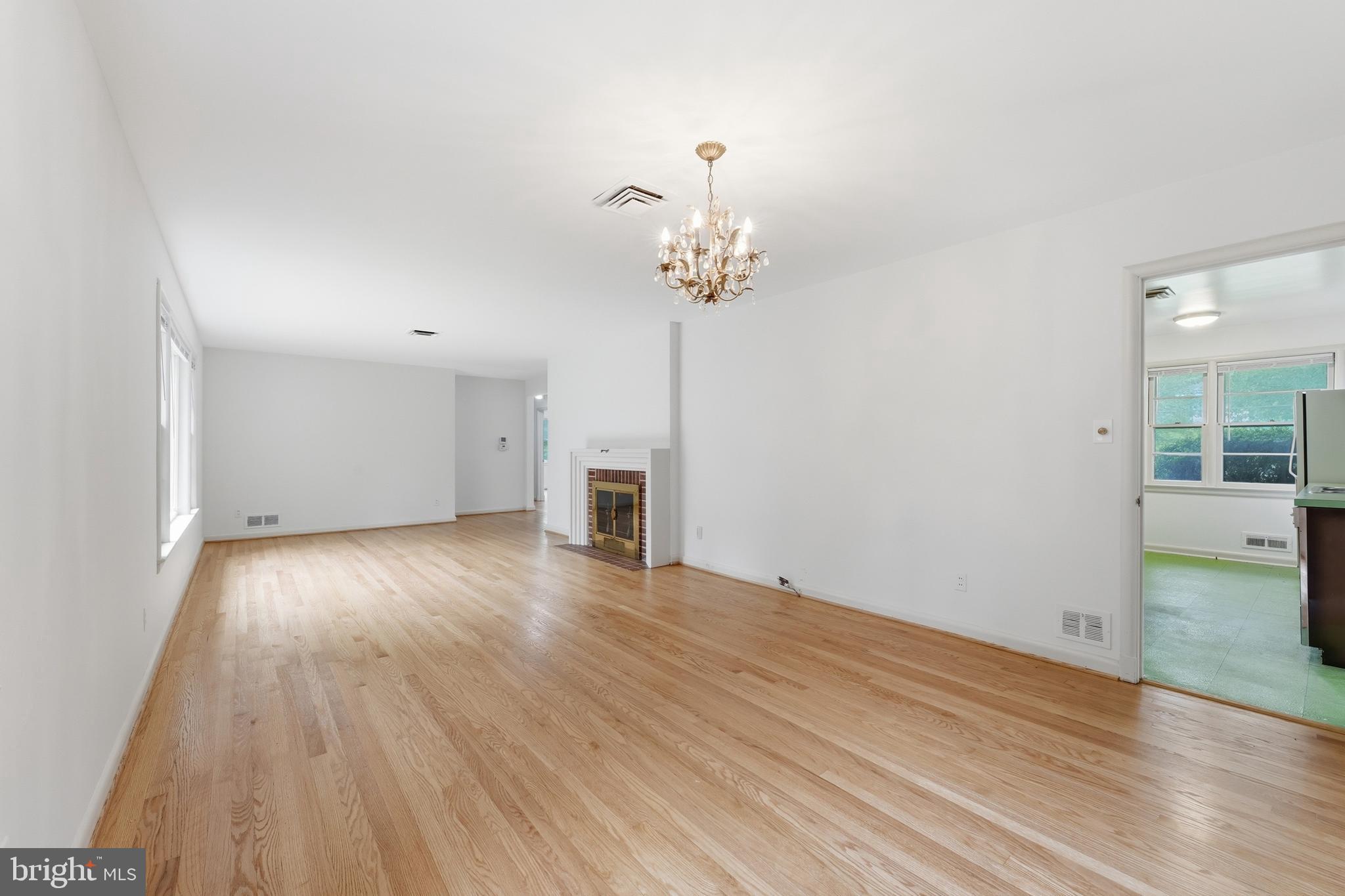 228 Northwest Terrace Silver Spring, MD 20901 - Photo 14 of 70 a view of empty room with wooden floor and ceiling fan