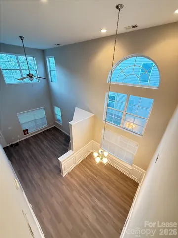 a view of a living room and wooden floor