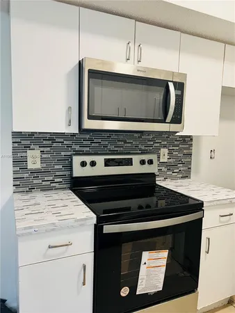 a bathroom with a sink toilet a mirror and shower