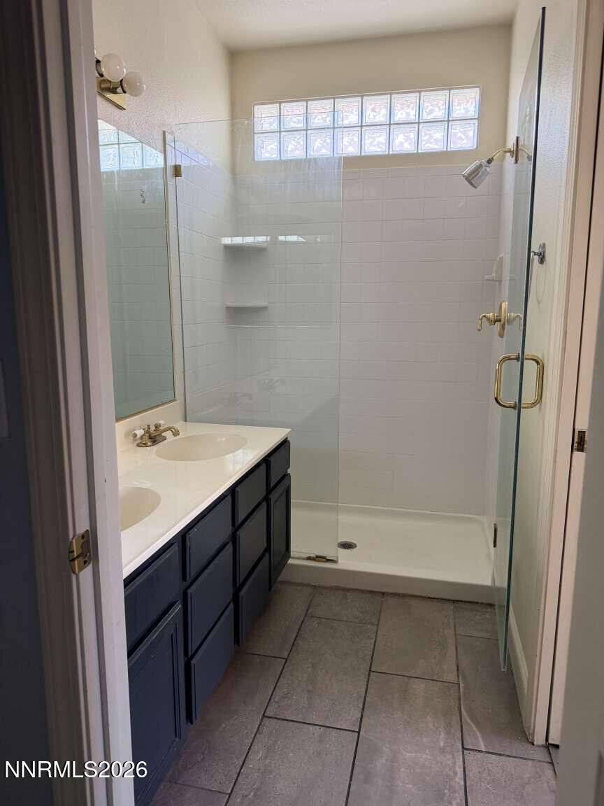 4695 Hampton Lane Reno, NV 89519 - Photo 9 of 20 a bathroom with a bathtub sink and mirror