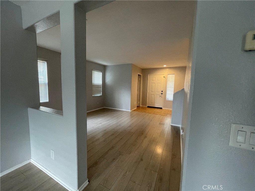 38017 Greenleaf Place Murrieta, CA 92562 - Photo 20 of 37 a view of a hallway with wooden floor