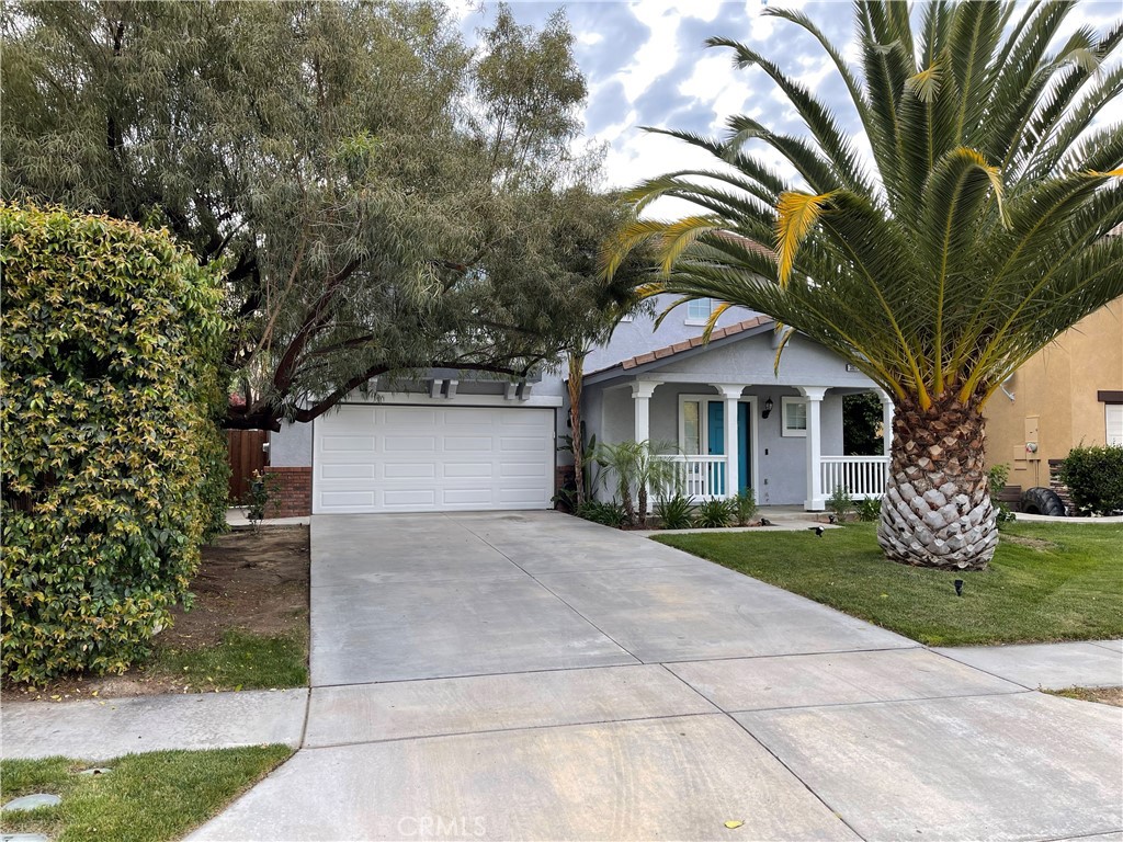 38017 Greenleaf Place Murrieta, CA 92562 - Photo 2 of 37 a front view of a house with a yard and garage