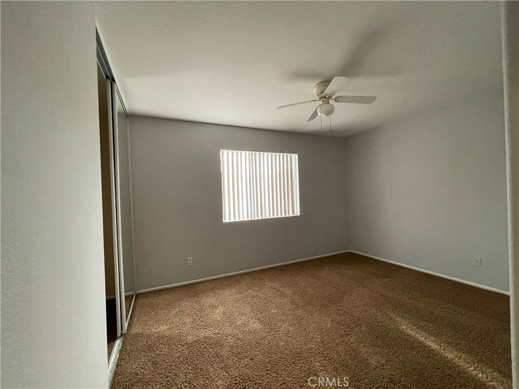 38017 Greenleaf Place Murrieta, CA 92562 - Photo 25 of 37 an empty room with windows and fan