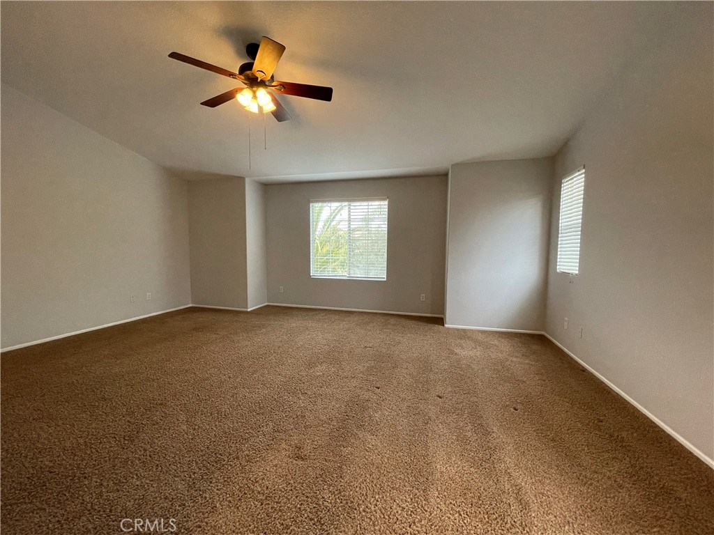 38017 Greenleaf Place Murrieta, CA 92562 - Photo 31 of 37 a view of a livingroom with a ceiling fan and window