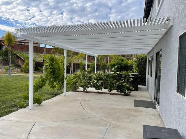 a view of a patio with plants and garden