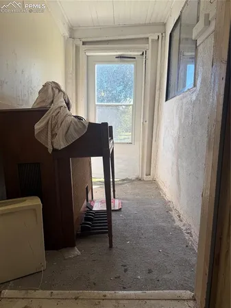 a living room with a couch and a window