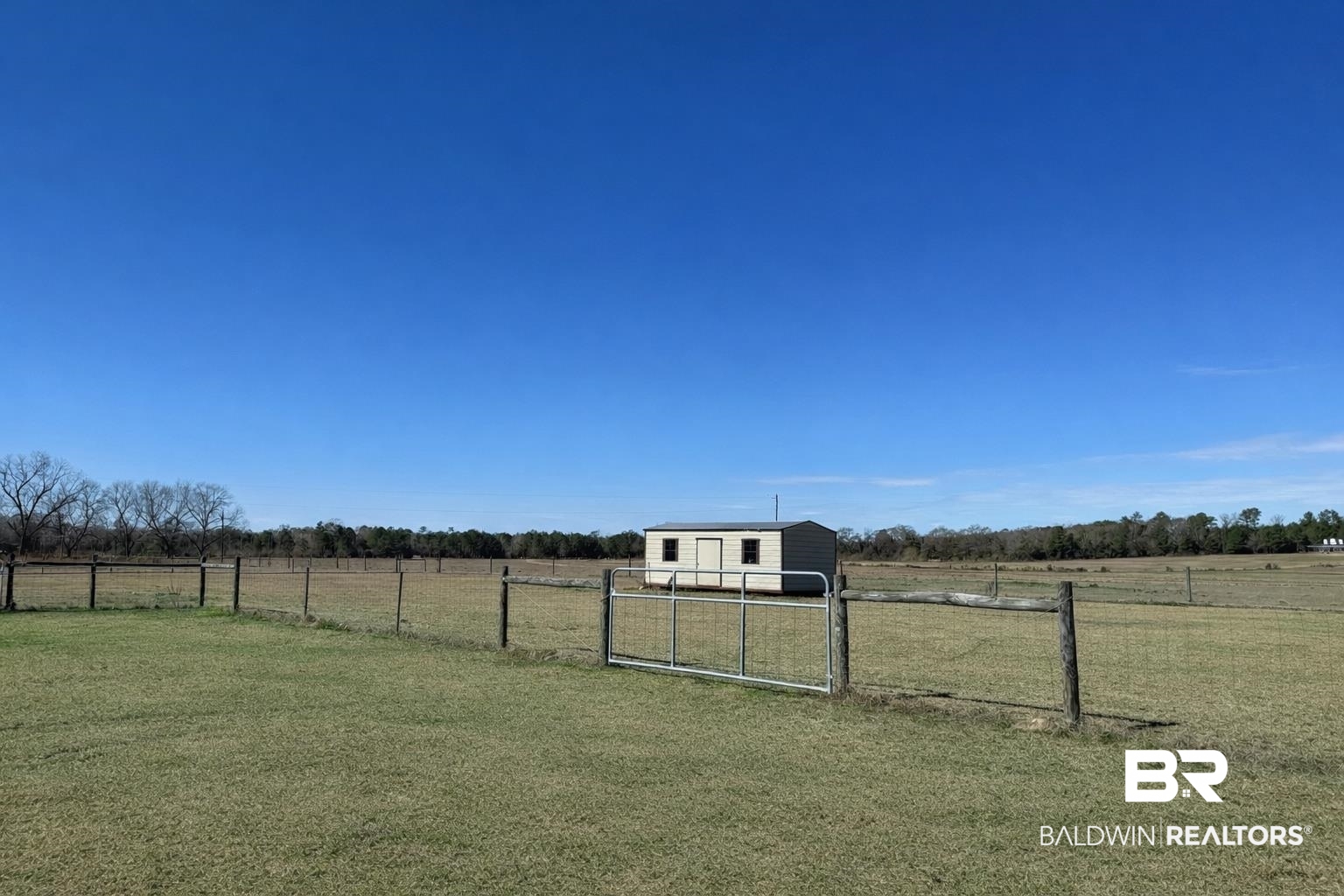 1064 Old Fannie Road Flomaton, AL 36441 - Photo 2 of 17 View of yard featuring a view of countryside, a gate, and a storage shed