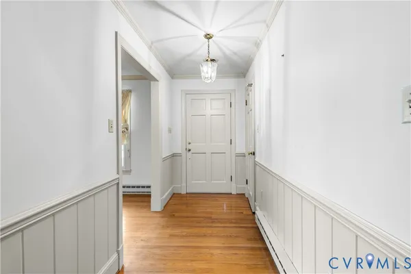 a view of a hallway with a chandelier