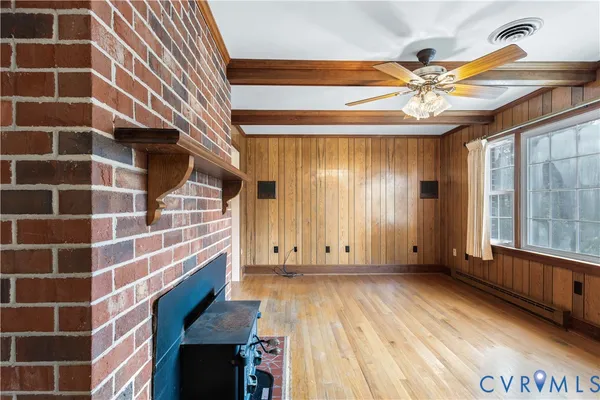 wooden floor in an empty room with a window