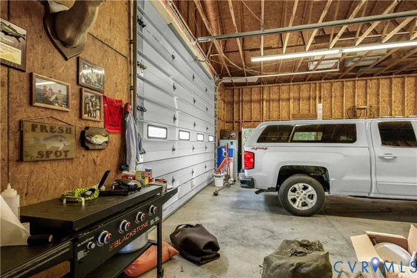 a view of residential houses with snow on the road