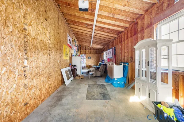 a wooden bench sitting in the middle of a yard