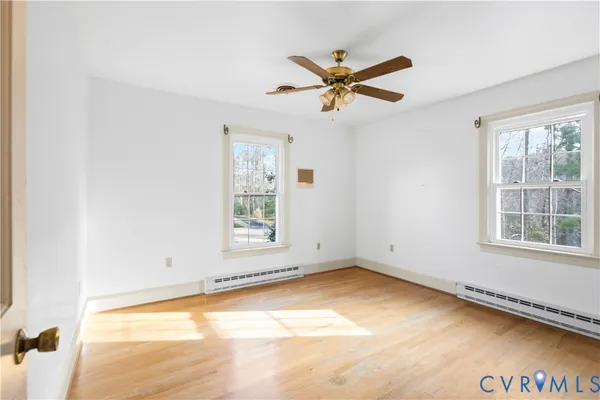 a view of a hallway with a chandelier fan and interior of the house