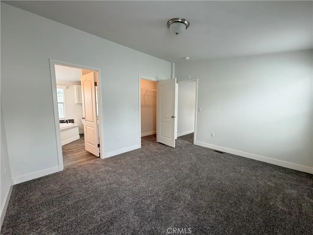 9080 Bloomfield Avenue, Unit 145 Cypress, CA 90630 - Photo 15 of 26 an empty room with a empty space and windows