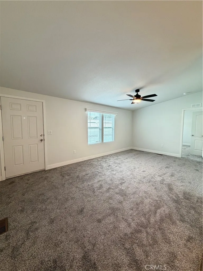 9080 Bloomfield Avenue, Unit 145 Cypress, CA 90630 - Photo 18 of 26 an empty room with windows and cabinet