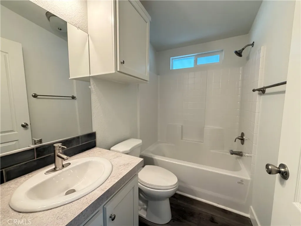9080 Bloomfield Avenue, Unit 145 Cypress, CA 90630 - Photo 19 of 26 a bathroom with a sink toilet and shower