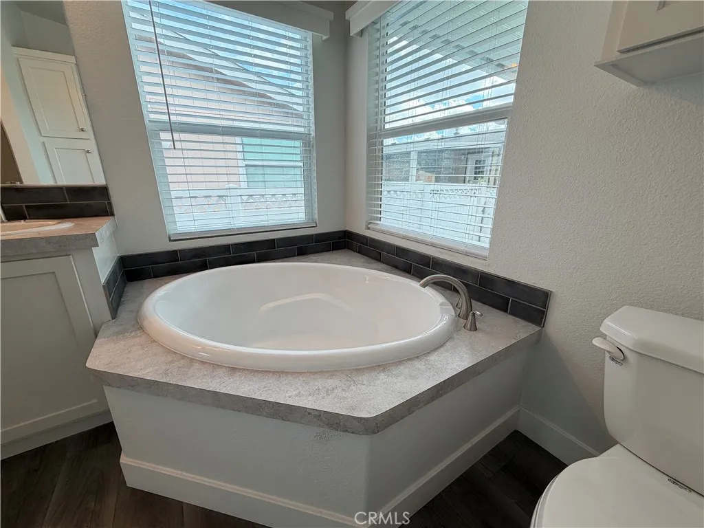 9080 Bloomfield Avenue, Unit 145 Cypress, CA 90630 - Photo 24 of 26 a bathroom with a sink and a toilet