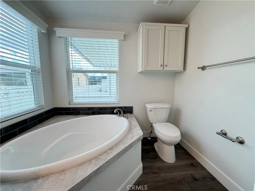 9080 Bloomfield Avenue, Unit 145 Cypress, CA 90630 - Photo 25 of 26 a bathroom with a sink and a toilet