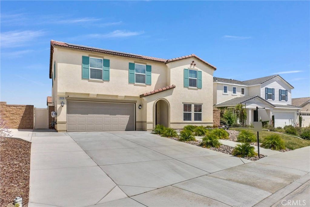 26538 San Jacinto Road Menifee, CA 92585 - Photo 1 of 34 a front view of a house with a yard and garage
