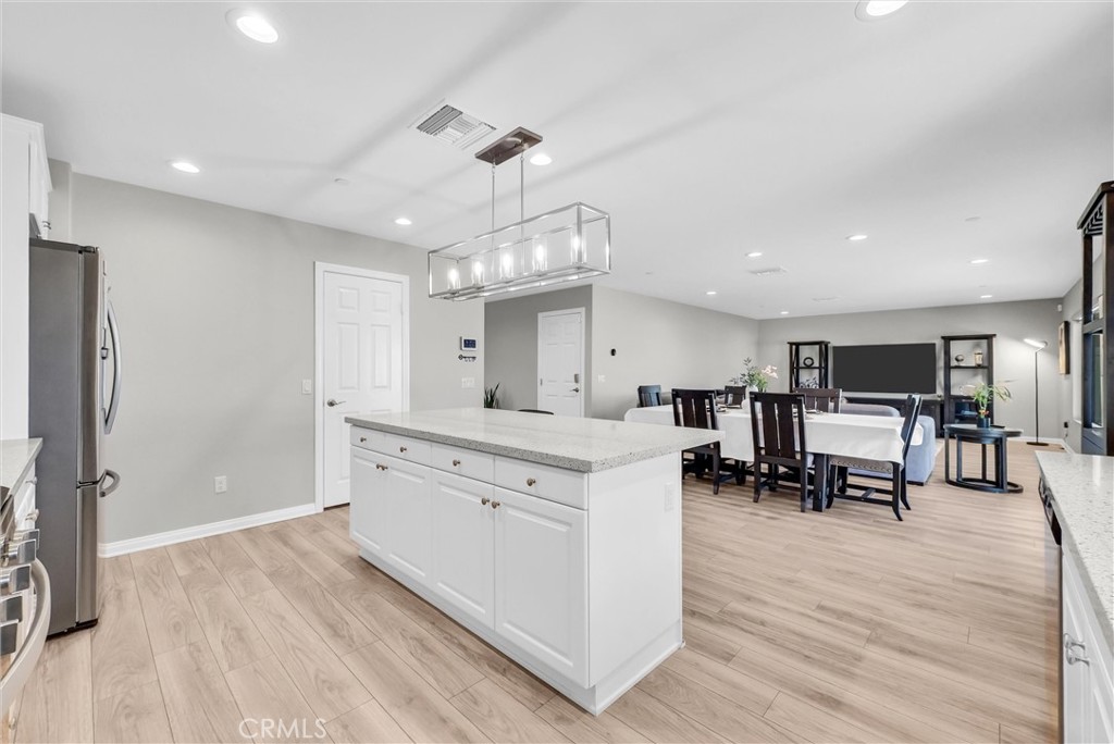 26538 San Jacinto Road Menifee, CA 92585 - Photo 12 of 34 a large white kitchen with lots of counter space