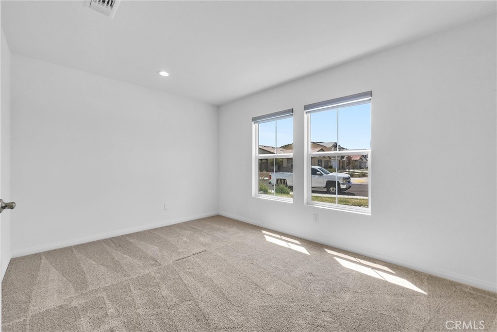 26538 San Jacinto Road Menifee, CA 92585 - Photo 13 of 34 an empty room with windows