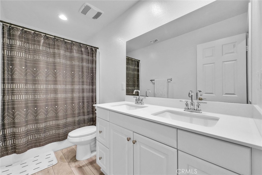 26538 San Jacinto Road Menifee, CA 92585 - Photo 18 of 34 a bathroom with a sink a toilet and shower