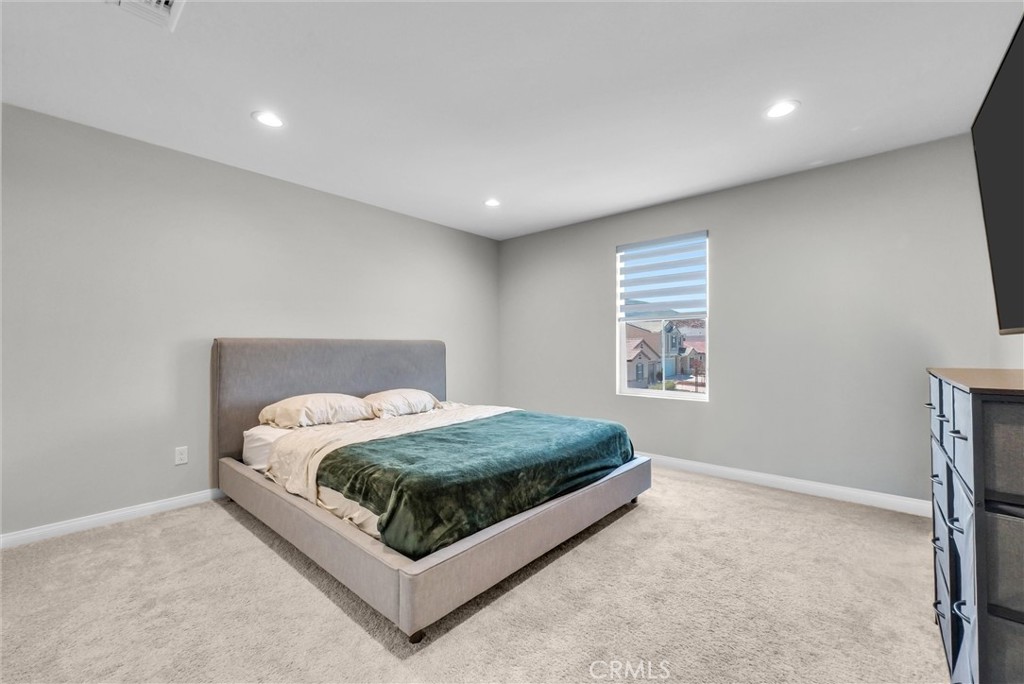 26538 San Jacinto Road Menifee, CA 92585 - Photo 21 of 34 a bed room with a bed and a window