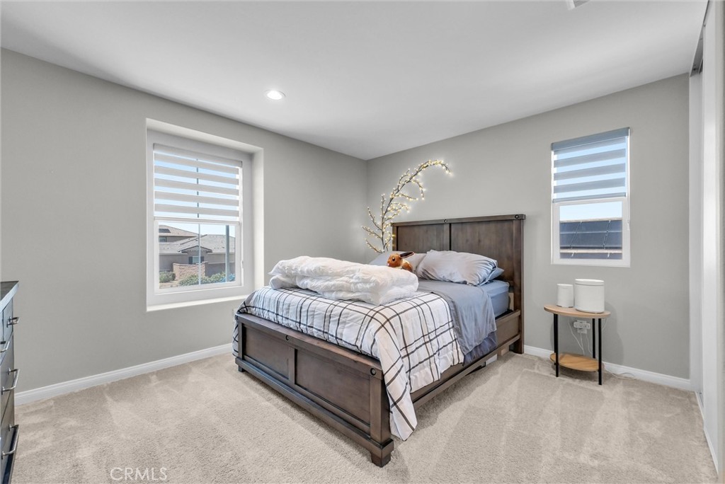 26538 San Jacinto Road Menifee, CA 92585 - Photo 22 of 34 a bed room with a bed and a window