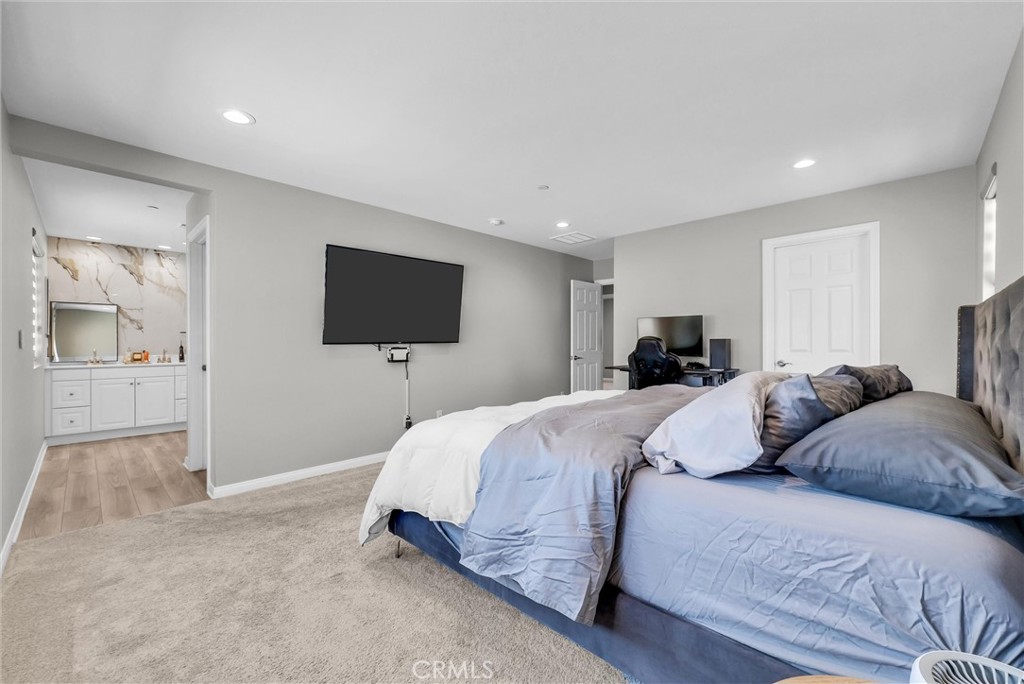 26538 San Jacinto Road Menifee, CA 92585 - Photo 26 of 34 a bedroom with a bed and a flat screen tv