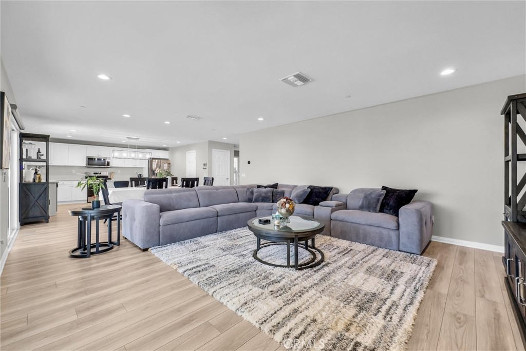 26538 San Jacinto Road Menifee, CA 92585 - Photo 6 of 34 a living room with furniture and view of kitchen