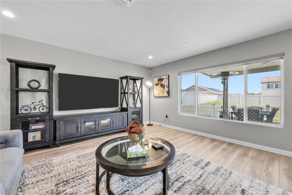 26538 San Jacinto Road Menifee, CA 92585 - Photo 7 of 34 a living room with furniture and a flat screen tv