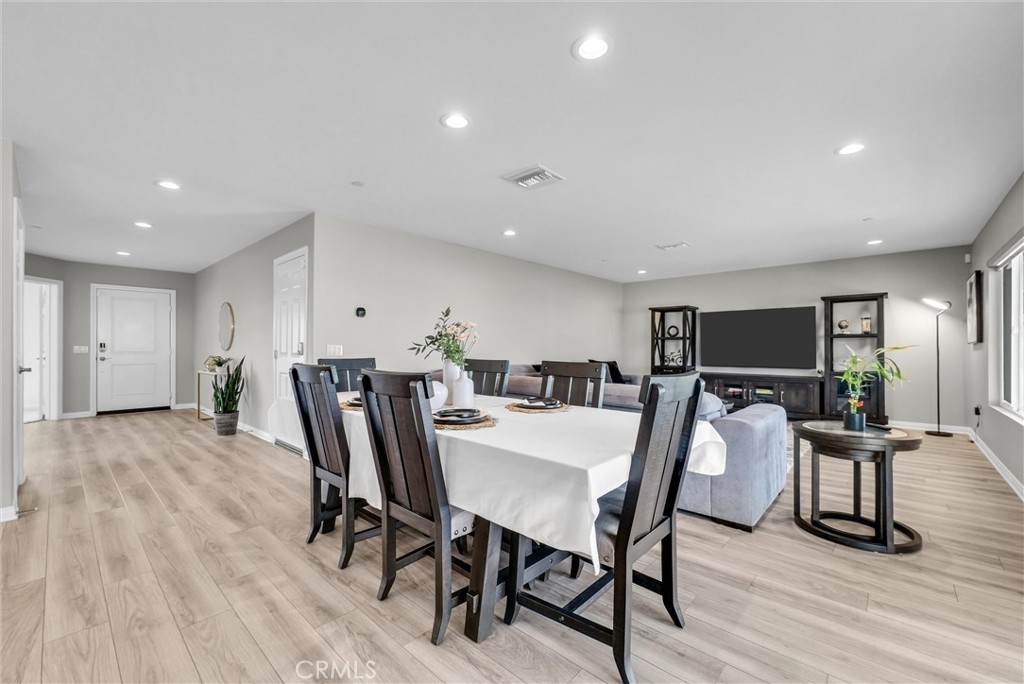 26538 San Jacinto Road Menifee, CA 92585 - Photo 9 of 34 a view of a dining room with furniture and wooden floor