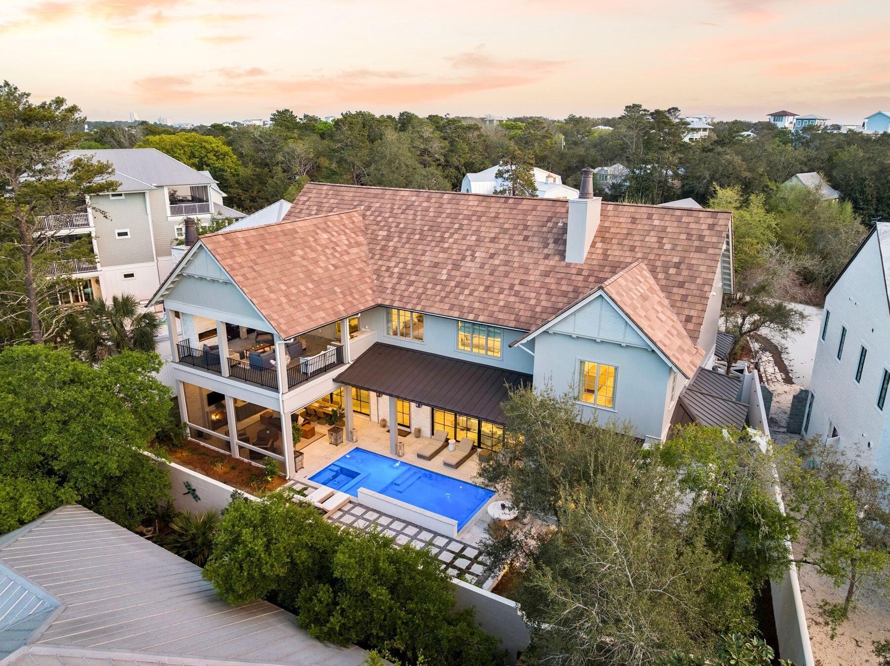215 Dogwood Street Santa Rosa Beach, FL 32459 - Photo 3 of 91 an aerial view of a house with a yard potted plants and a large tree