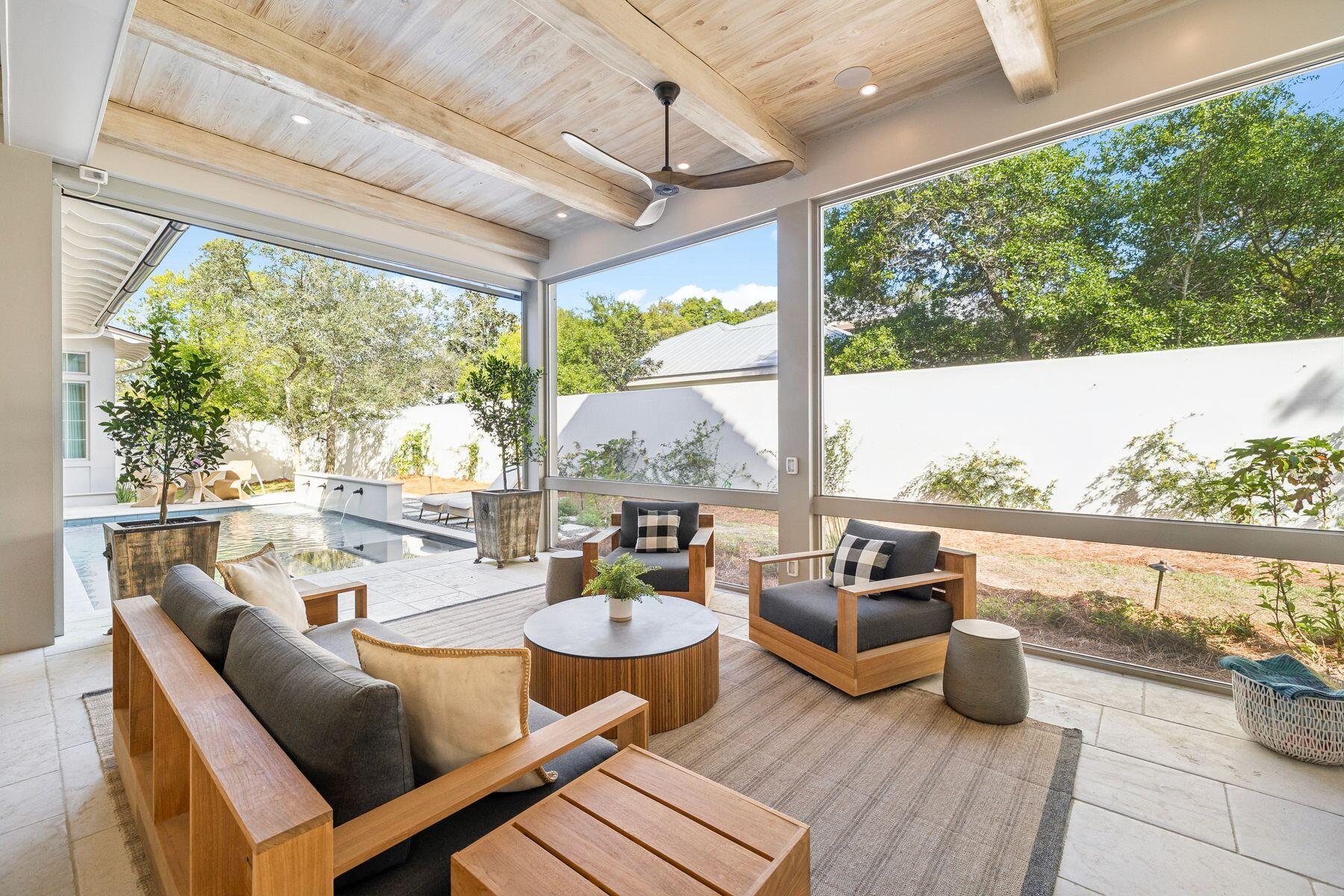215 Dogwood Street Santa Rosa Beach, FL 32459 - Photo 36 of 91 a outdoor space with patio the couches and chairs with wooden floor