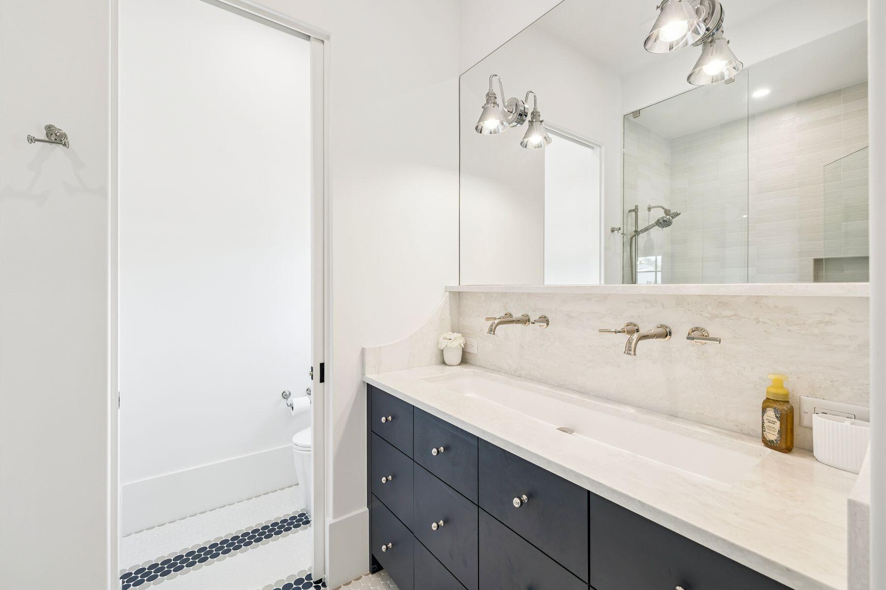 215 Dogwood Street Santa Rosa Beach, FL 32459 - Photo 60 of 91 a bathroom with a sink a large mirror and shower