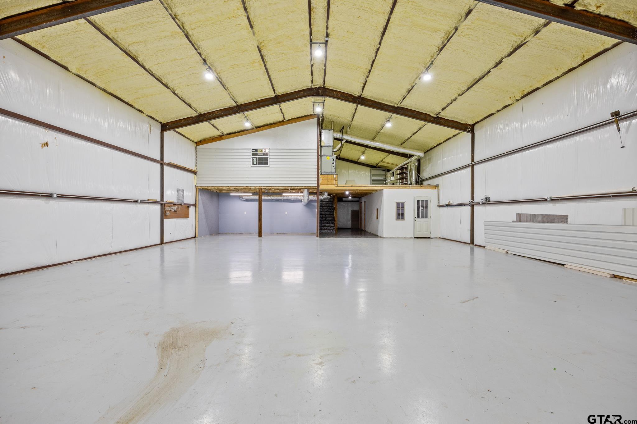 1428 Hagan Road Whitehouse, TX 75791 - Photo 6 of 37 a view of a room with racks on the wall