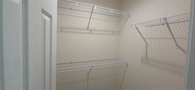 a view of a room with racks on the wall