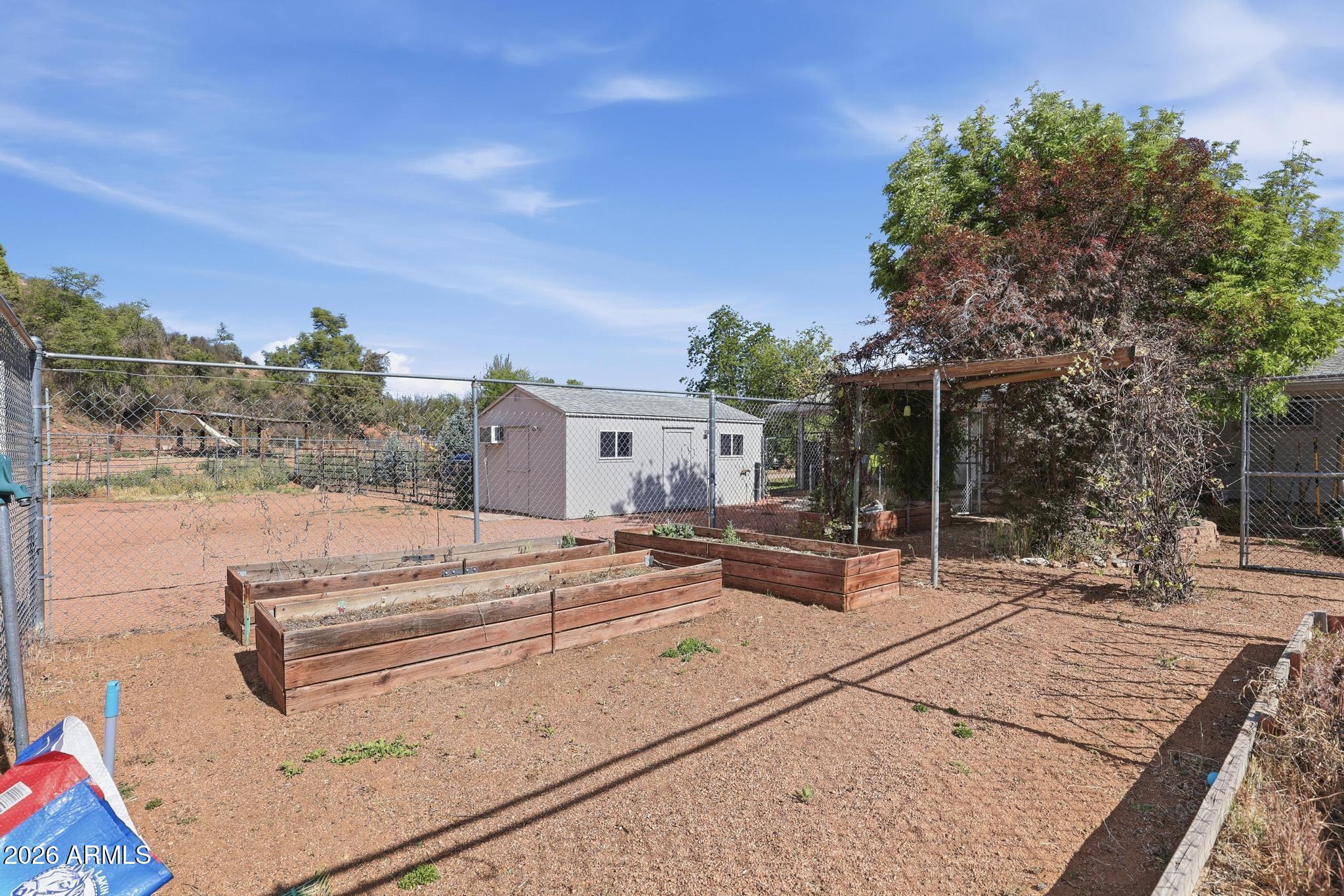 191 Cornerstone Way Payson, AZ 85541 - Photo 27 of 37 a view of a terrace with chairs and potted plants