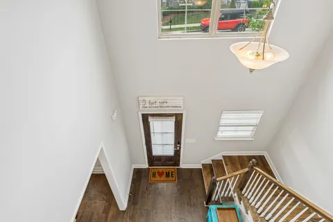 a view of an entryway with wooden floor