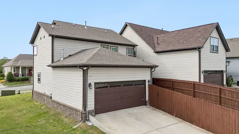 a front view of a house with garage