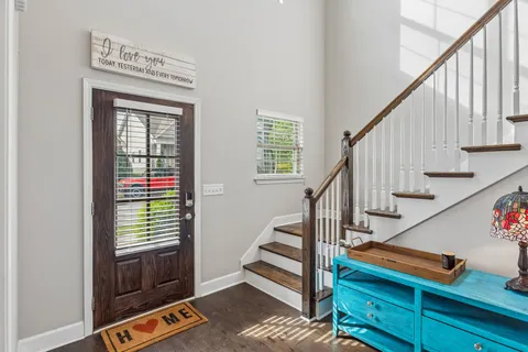 a view of entryway with stairs and wooden floor
